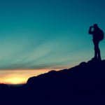 Man looking out on a mountain